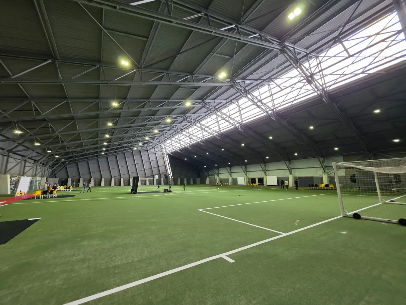 Interior of the indoor training facility at Proximus Basecamp equipped with Lumosa LED lighting.