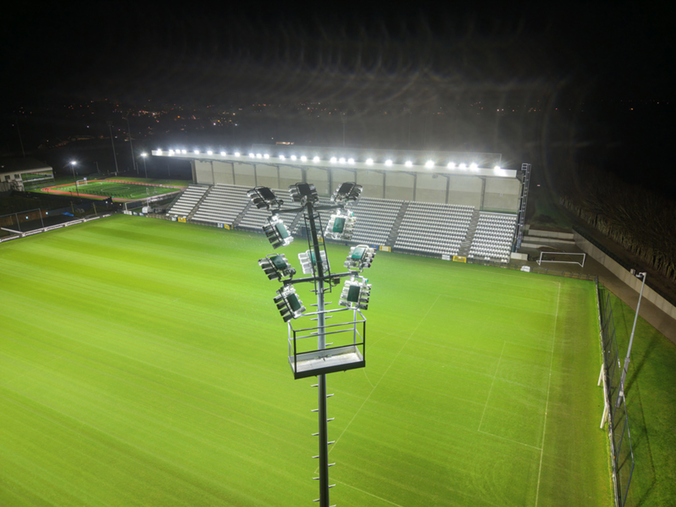 Lumosa LED floodlight mast at Proximus Basecamp providing uniform lighting for the Belgian national football team training pitches.